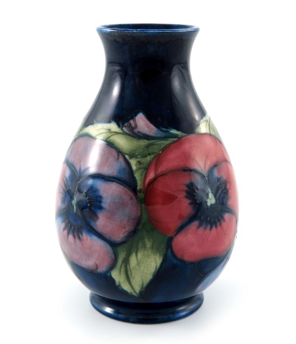 William Moorcroft, a small Pansy on blue vase, circa 1928, baluster form, impressed marks and