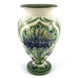 William Moorcroft, a Cornflower on White vase, circa 1914, footed shouldered form with everted
