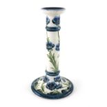 William Moorcroft for James MacIntyre, a blue Poppy on white candlestick, circa 1903, Tuscan