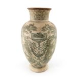 Edwin Martin for Martin Brothers, an unglazed stoneware vase, 1896, footed and shouldered form