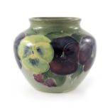 William Moorcroft, a small Pansy on green vase, circa 1915, shouldered ovoid form, impressed Burslem