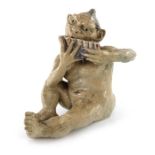 Robert Wallace Martin for Martin Brothers, a stoneware model of a grotesque imp playing the pan