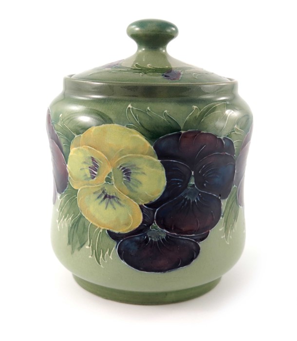William Moorcroft, a Pansy on green jar and cover, circa 1916, waisted cylindrical ovoid form,