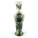 William Moorcroft, a Cornflower on white vase, circa 1914, elongated shouldered form, impressed