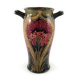 William Moorcroft, a Cornflower twin handled vase, ogee cylincrical form, impressed Burslem marks