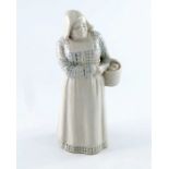 Leslie Harradine for Doulton Lambeth, a Dutch peasant woman figure, modelled carrying a basket, impr