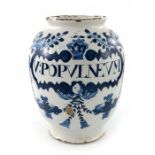 A London Delft drug jar, ovoid form, circa 1720, decorated in blue with a scrolling strapwork label