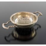 A George V silver tea strainer, in the form of a punch strainer, Mappin and Webb