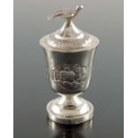 A Chinese export silver egg cup and cover, TM circa 1930, footed urn form, repousse decorated with