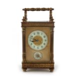 A gilt brass swiss carriage clock