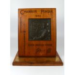 A bronze trophy plaque for Progress in Photography 1943