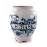 A London Delft drug jar, ovoid form, circa 1740, decorated in blue with a scrolling strapwork label