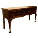 A George II oak and mahogany banded dresser