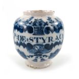 A London Delft pill jar, ovoid form, circa 1740, decorated in blue with a scrolling strapwork label