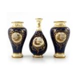 E O Ball for Coalport, a trio of small vases, painted with Scottish loch scenes