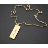 A 9 carat gold ingot pendant on chain