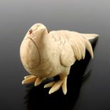 A 19th century Japanese carved ivory okimono of a hen