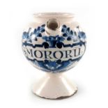 A Lambeth Delft wet drug jar, globular form on a spreading foot, loop handle and squat spout, circa