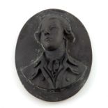 A Wedgwood black basalt relief moulded portrait plaque of William Pitt