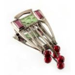 A Jugendstil plique a jour enamelled and gem set silver brooch