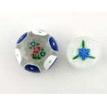 Perthshire, two floral paperweights, one double cased, faceted blue and white, the other with a blue