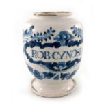 A London Delft drug jar, ovoid form, circa 1720, decorated in blue with a scrolling strapwork label