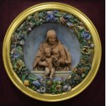 A Della Robbia plaque in a glass case