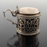 A George V silver reticulated mustard pot, Stokes and Ireland Ltd., Chester 1922