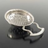 A George II silver lemon or punch strainer, George Greenhill Jones, London 1740