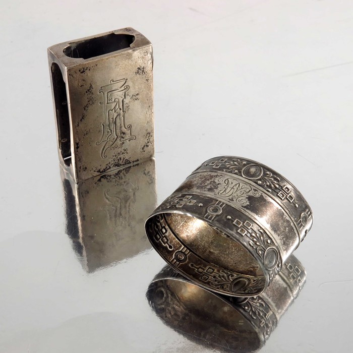 An Imperial Russian silver match box case, together with a Continental silver napkin ring