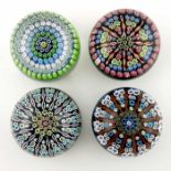 Perthshire, four concentric millefiori paperweights, three with signature canes one with original l