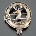 A white metal clan badge for Gordon