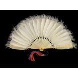 A Chinese carved ivory and feather fan