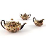 A Royal Crown Derby miniature three piece tea set, Imari 6299