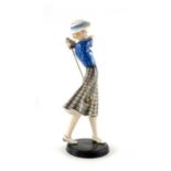 Stephan Dakon for Goldscheider, a figure of a young woman golfer, circa 1935, modelled hat, blue blo