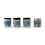 A group of four London Delft pill jars, cylinder form, circa 1750, one decorated in blue with a scro
