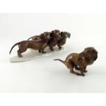 Fritz Heidenreich for Rosenthal, a figure group of three dachshunds, together with another figure