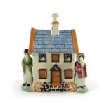 A Prattware cottage money box