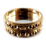 An 18 carat gold wedding ring