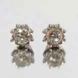 A pair of diamond stud earrings,