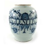 A London Delft drug jar, ovoid form, circa 1750, decorated in blue with a scrolling strapwork label