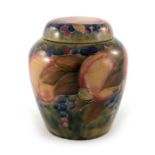 William Moorcroft for Liberty and Co., a Pomegranate on ochre ginger jar and cover