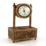 A gilt metal automaton alarm clock