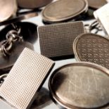 Three pairs of engine turned silver cufflinks