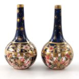 A pair of Royal Crown Derby miniature Imari Japanese bottle vases