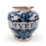 A London Delft pill jar, ovoid form, circa 1720, decorated in blue with a scrolling strapwork label