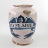 A Lambeth Delft drug jar, ovoid form, circa 1670, decorated in blue with a scrolling strapwork label