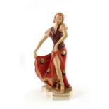Royal Dux, an Art Deco figure, modelled as a woman in butterfly wing dress, impressed marks and pink