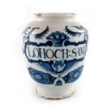 A London Delft drug jar, ovoid form, circa 1730, decorated in blue with a scrolling strapwork label