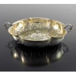 A 17th century German silver and parcel gilt twin handled wine taster or dish, Paul Hedel Hofer, Bre